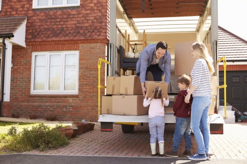 Experienced movers in Greenwich transporting furniture with care