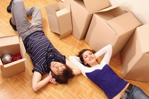 Local movers handling furniture access in a Greenwich property with tight stairs