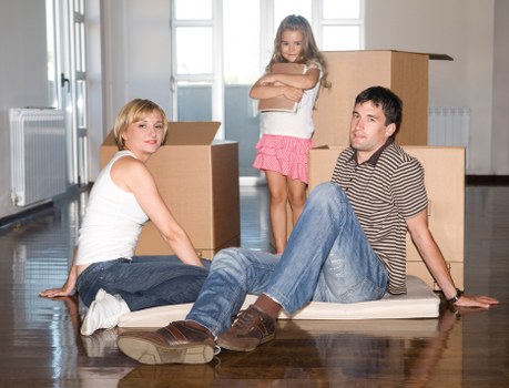 Packed moving boxes ready for urgent removals in a Greenwich property